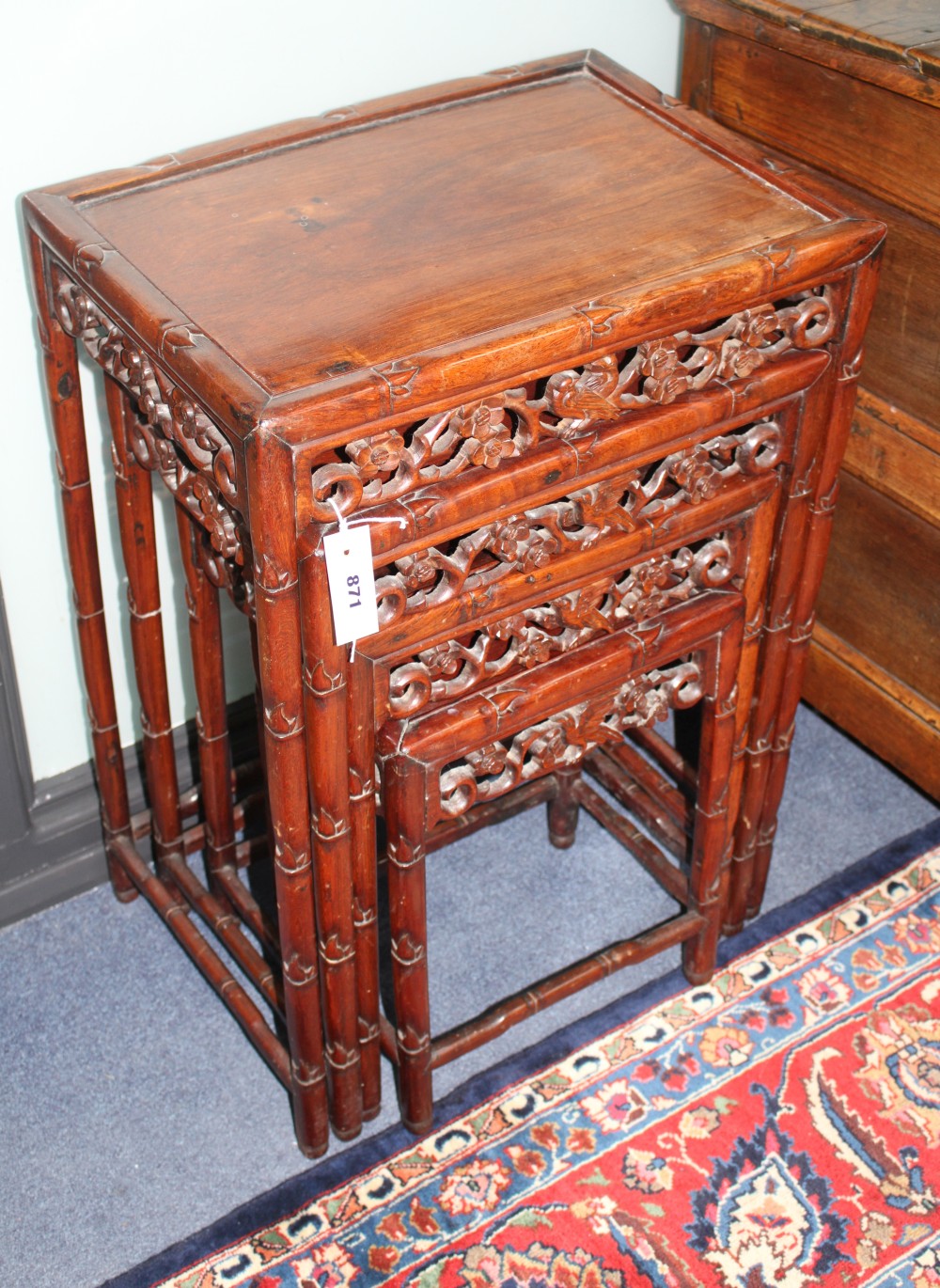 A nest of four 19th century Chinese carved pierced hardwood tables, W.50cm D.36cm H.71cm